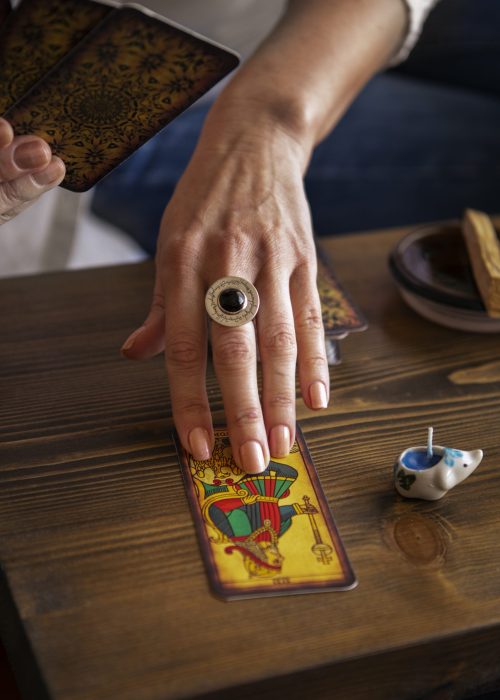 high-angle-woman-reading-tarot (1)