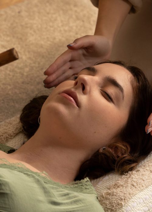 person-conducting-reiki-therapy