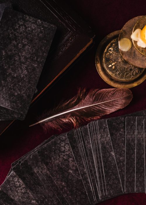 Tarot cards and esoteric concept. Magic rituals. Mystical table with details. View from above. Close-up