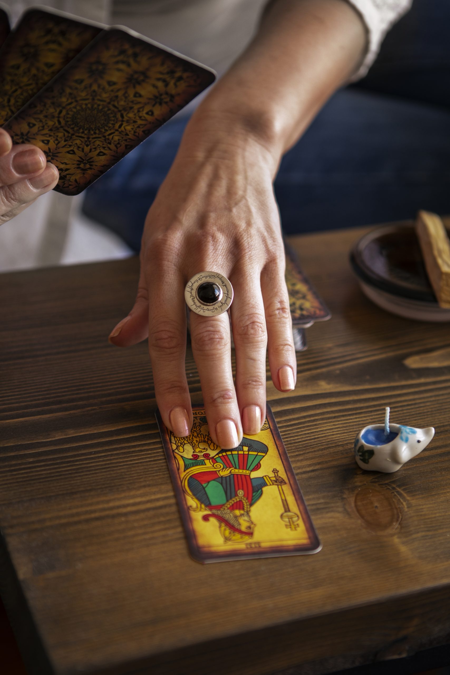 high-angle-woman-reading-tarot (1)