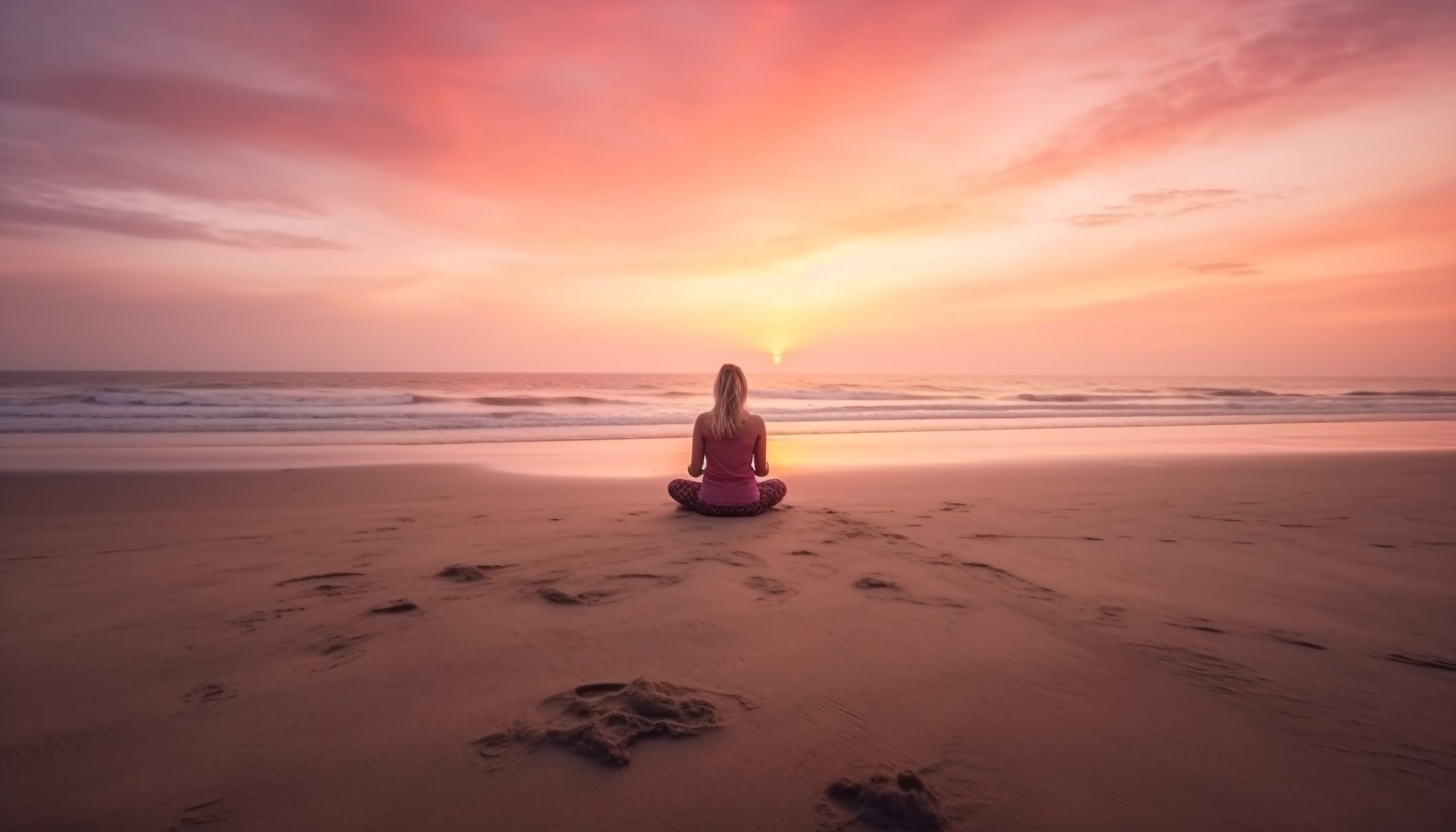 One woman meditating on tranquil beach at dusk generated by artificial intelligence